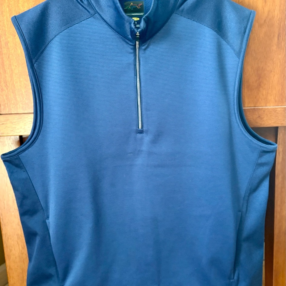 Greg Norman Collection Multicolor Shark Logo on Blue Background